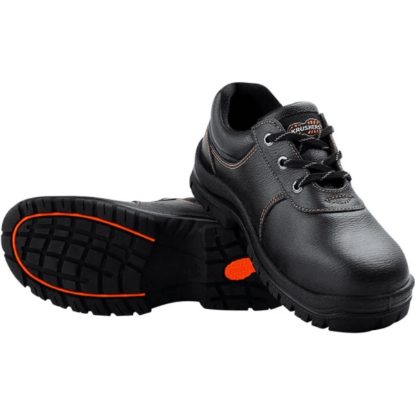 A pair of black safety shoes with vibrant orange outsoles, designed for enhanced protection and visibility.