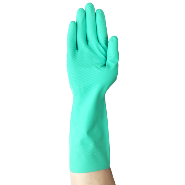 A person wearing a green latex glove, preparing to clean a surface.