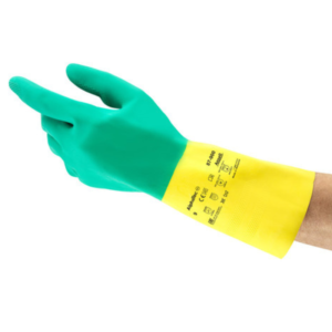 A person wearing yellow and green gloves, ready for work or protection.