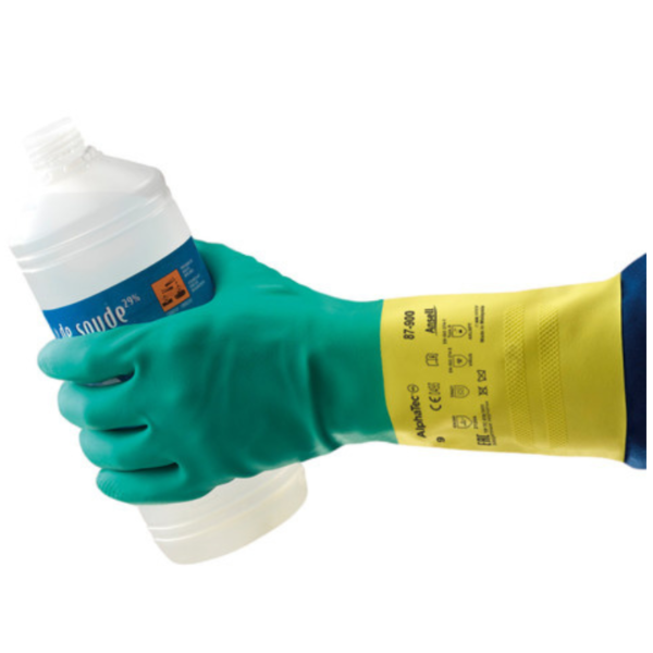 A person holding a bottle with a green and yellow glove.