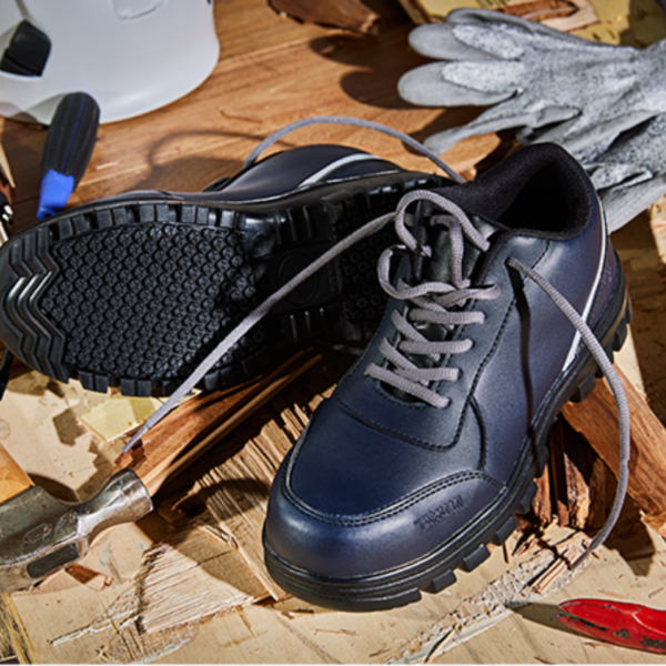 Blue work shoes on a table, ready for a hard day's work.